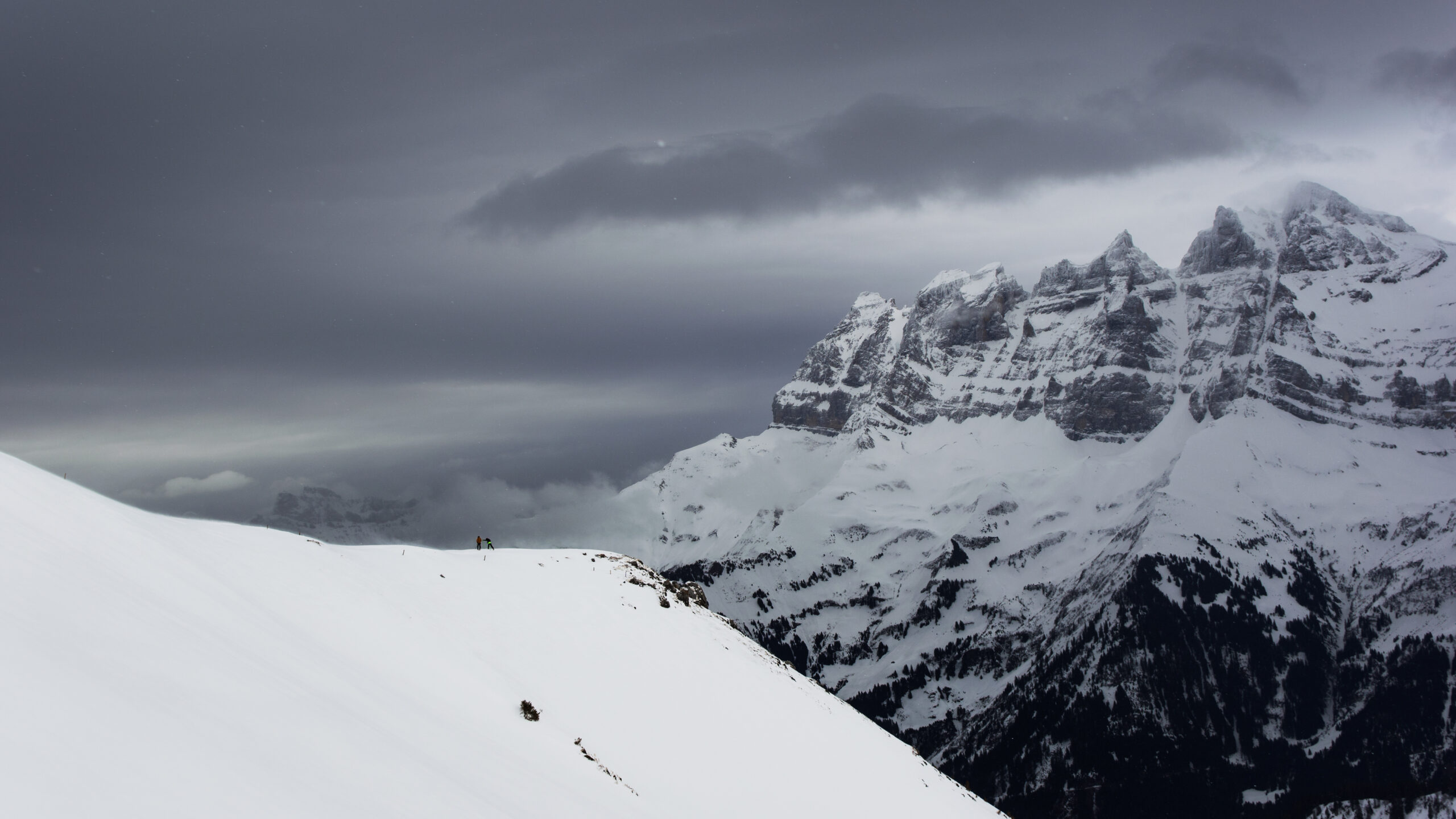 Two skiers and a mountain ridge, 2018